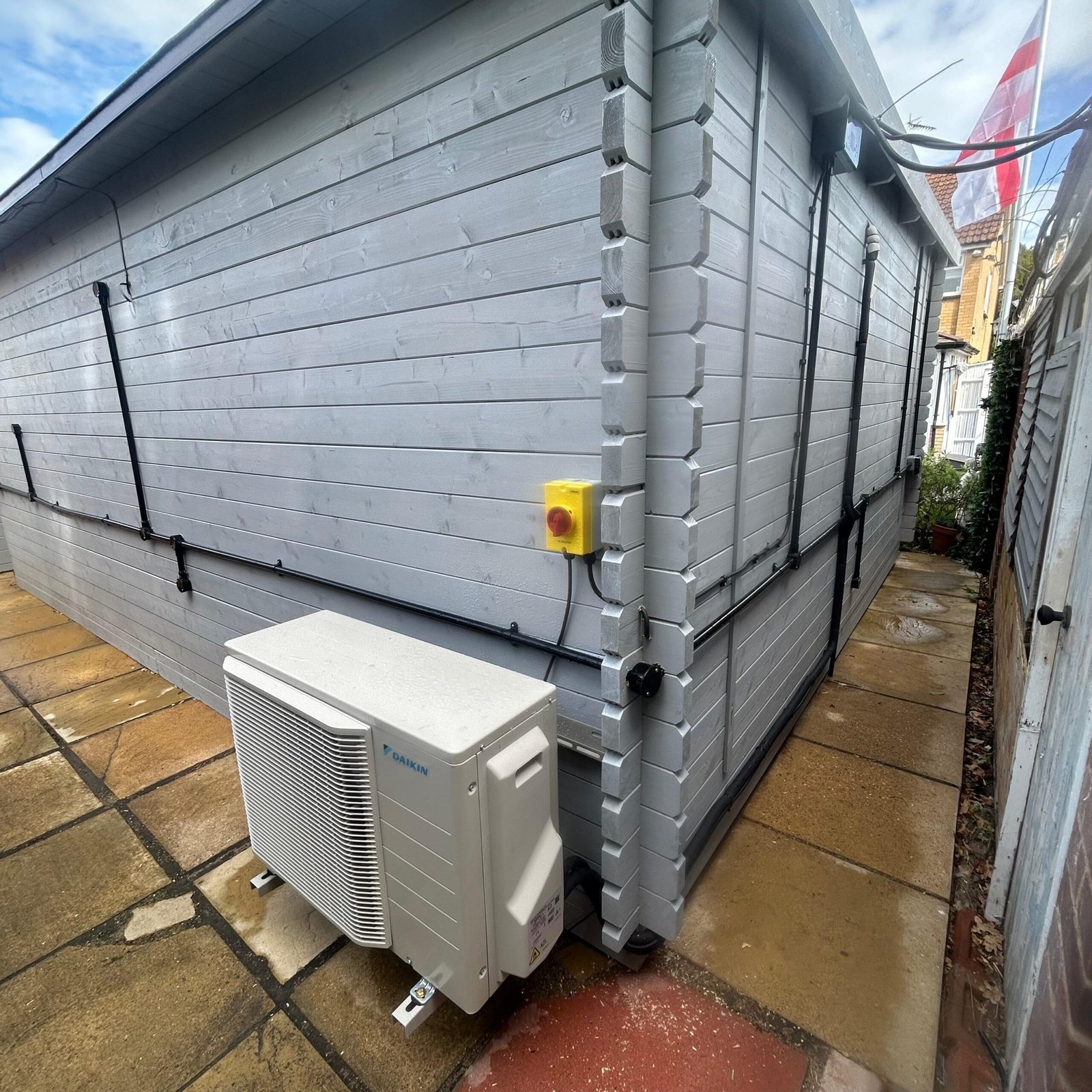 Neatly routed refrigerant pipework on an exterior wall, installed by Tempest Air Conditioning